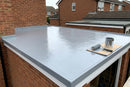 Finished grey GRP fibreglass flat roof on a UK garage with edge trims