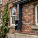 72x72mm Flush Joint Aluminium Downpipe Shoe — RAL 7021 (in use)