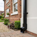 72x72mm Flush Joint Aluminium Downpipe Shoe — RAL 9005 (in use)