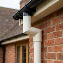 76mm Diameter Flush Joint Aluminium Downpipe Bends — RAL 9010 / 92.5 Deg (in use)