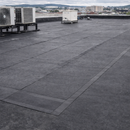 Large commercial flat roof covered with 2.5mm self-adhesive EPDM partial bond membrane and HVAC units - commercial roofing UK