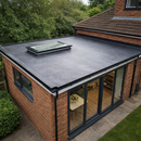 Completed house extension with 2.5mm full-bond EPDM flat roof, rooflight and bifold doors - full bond EPDM membrane UK