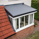 Completed EPDM flat roof on house extension dormer next to tiled roof - professional dormer flat roofing kit UK