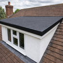 Completed EPDM rubber flat roof on house dormer extension with black membrane trim - rubber roof kit UK