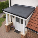 Completed EPDM rubber flat roof on house porch canopy with black edge trim - dormer EPDM roofing kit UK