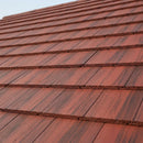 UK pitched roof covered in dark red interlocking concrete roof tiles