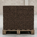Stack of natural expanded cork insulation boards showing granulated cork texture and board thickness