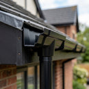 Moulded Ogee Gutter Outlet 76mm Diameter 125 x 100mm — RAL 9005 (in use)
