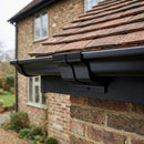 Moulded Ogee Gutter Jointer 125 x 100mm Marine Grade — RAL 9005 (in use)
