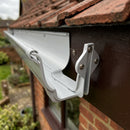 Moulded Ogee Gutter Fascia Bracket 125 x 100mm — RAL 9006 (in use)