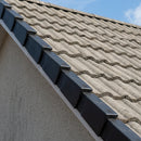 Black dry-fix verge kit units fitted along a pitched roof gable edge over grey concrete tiles