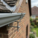 Moulded Ogee Gutter Rise and Fall Bracket 125 x 100mm — RAL 7037 (in use)