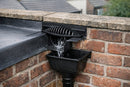 EPDM horizontal drain kit through a brick parapet wall discharging into a rainwater hopper