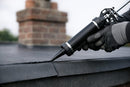 EPDM lap sealant being gunned in a neat bead along a membrane seam edge on a rubber flat roof