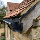 Moulded Ogee Gutter Side Rafter Bracket 125 x 100mm — RAL 9005 (in use)