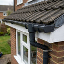 63mm Diameter Gutter Outlet Spigot Extender — RAL 7021 (in use)