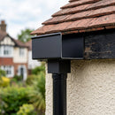 Aluminium Box Gutter Outlet 72×72mm to 135×100mm — Textured Black (in use)