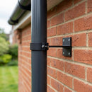 Adjustable Aluminium Pipe Clip 76mm Diameter — Textured Black (in use)