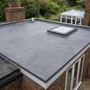 Finished 1.5mm EPDM rubber flat roof on house extension with rooflight and bi-fold doors - flat roofing UK