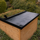 Finished garden outbuilding with EPDM rubber flat roof and black metal edge drip trims - garden room EPDM kit UK
