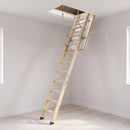 Fire-rated timber loft ladder folded down from an insulated white loft hatch on a bright UK landing
