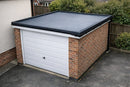 Freestanding brick garage with slate grey EPDM rubber flat roof, kerb edge trims and gutter drip edge along the long side