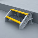 Two-tread GRP access steps on a flat roof giving access up to a low parapet upstand
