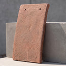 Single handmade clay plain roof tile in the Sussex Brown colourway