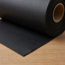 Close-up of black lead-free flashing roll showing texture and cut edge