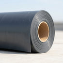 Rolled PVC single-ply roofing membrane roll showing cut edge and texture