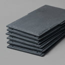 Close-up stack of recycled rubber synthetic slate roof tiles showing texture