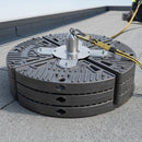Freestanding weighted roof safety anchor point on a flat roof with lanyard clipped in