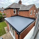 Single-storey rear extension with a finished 1.2mm slate grey EPDM rubber roof, gutter drip trim at the front, kerb trims on the sides and wall flashing against the house