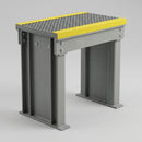 Detail of a tall GRP step-over platform showing the I-beam leg profile and gritted mesh deck