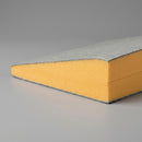 Cross-section detail of a tapered PIR insulation board showing the wedge profile and facer layers