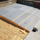 Tapered PIR insulation boards laid on a flat roof deck creating a drainage fall