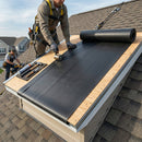Two roofers installing EPDM rubber flat roof membrane with edge drip trims on outbuilding - flat roofing UK