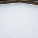 White reinforced TPO/FPO single-ply membrane installed on a flat roof with heat-welded seams and a brick parapet upstand